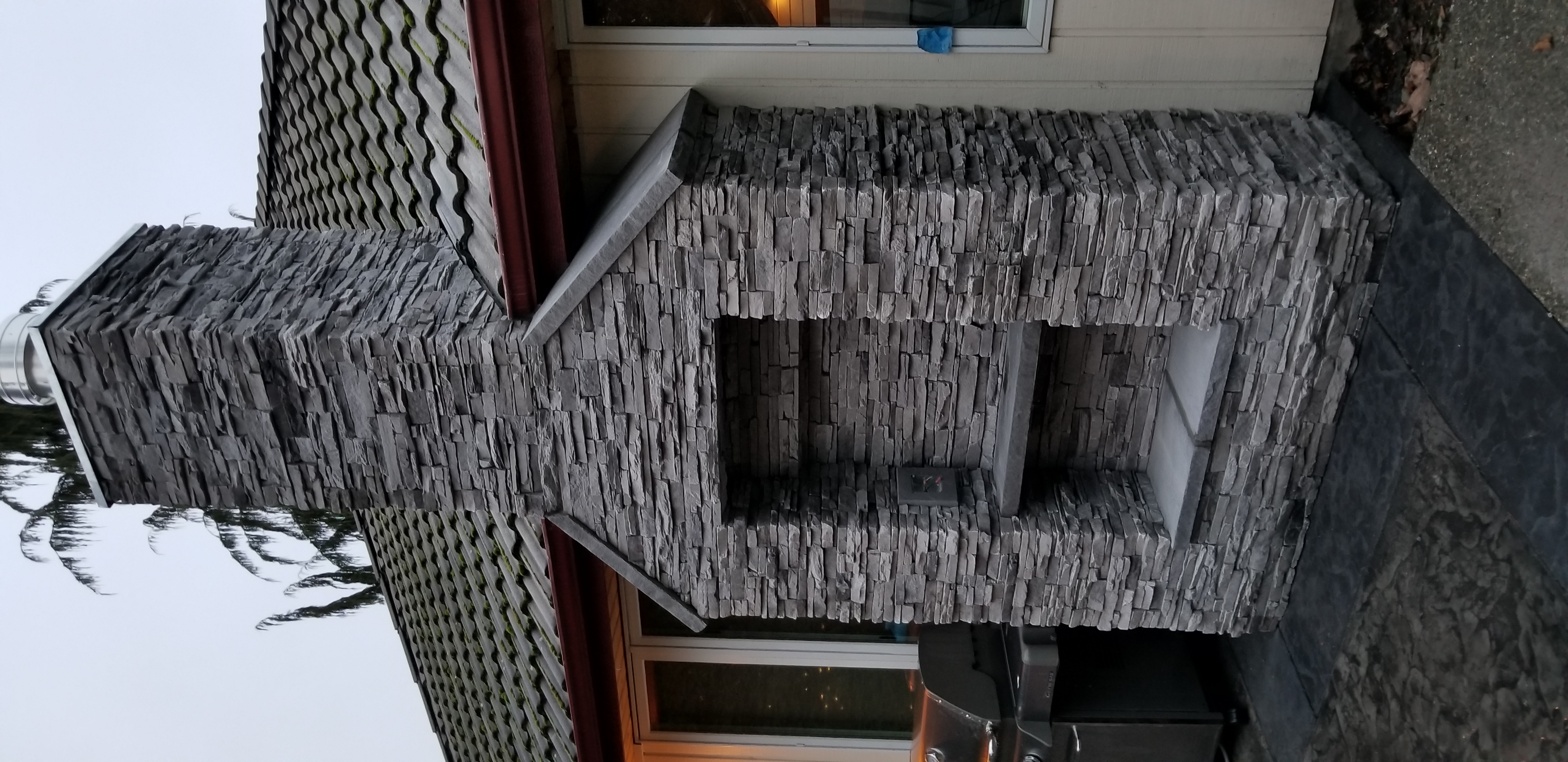 Stone chimney detail with stacked veneer