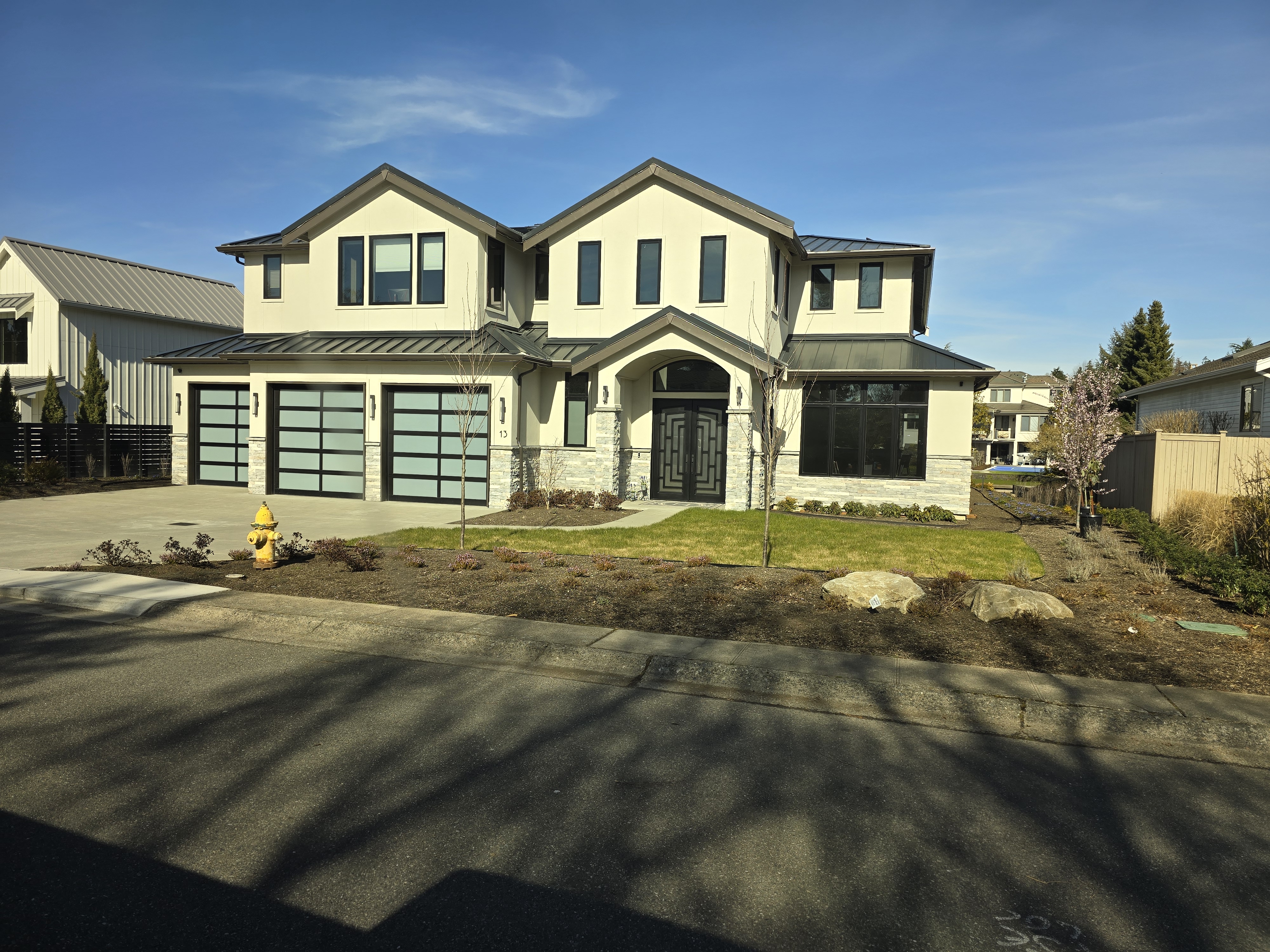 Large exterior renovation with stucco and stone details